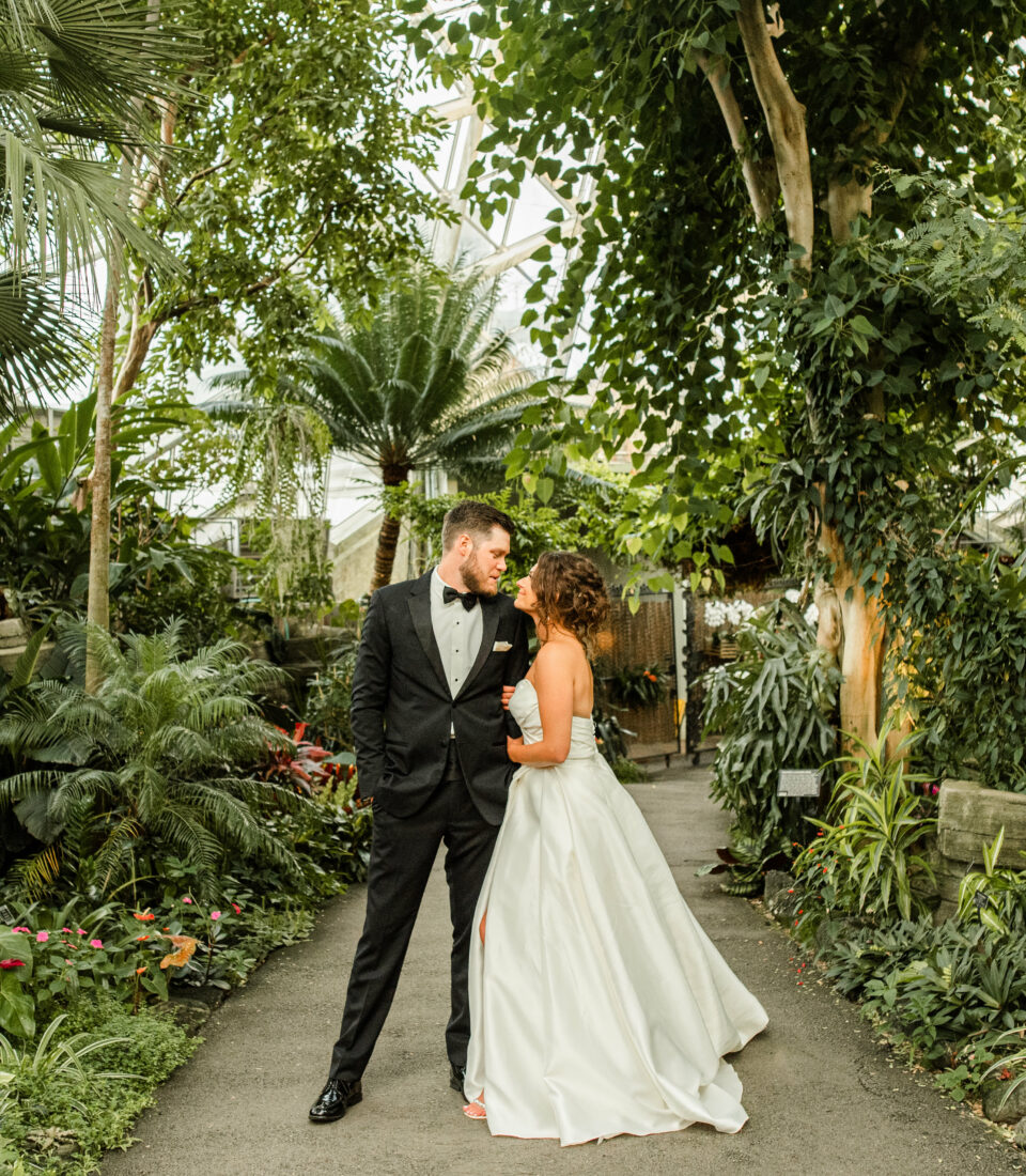 Wedding couple with plant surroundings