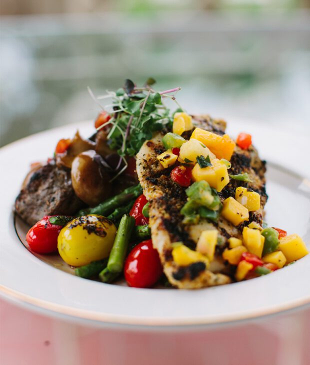 Surf and turf on plate with fresh vegetables