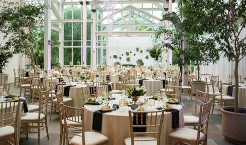 Round tables set up for an event inside of Boerner Botanical Gardens